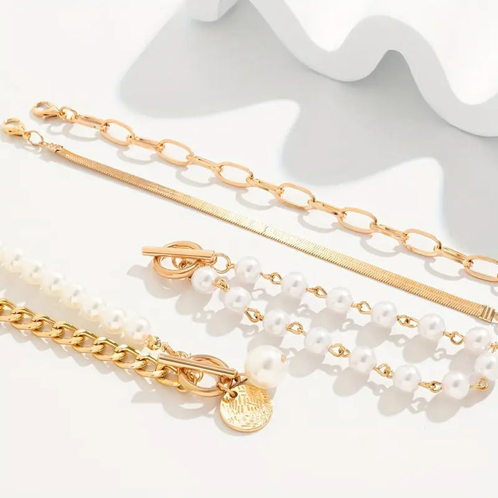 Conjunto de pulseras elegantes en oro (4 piezas) – serpiente, perlas y eslabones
