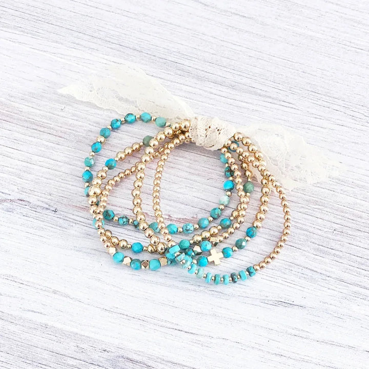 Pulsera de perlas de cruz vintage en turquesa