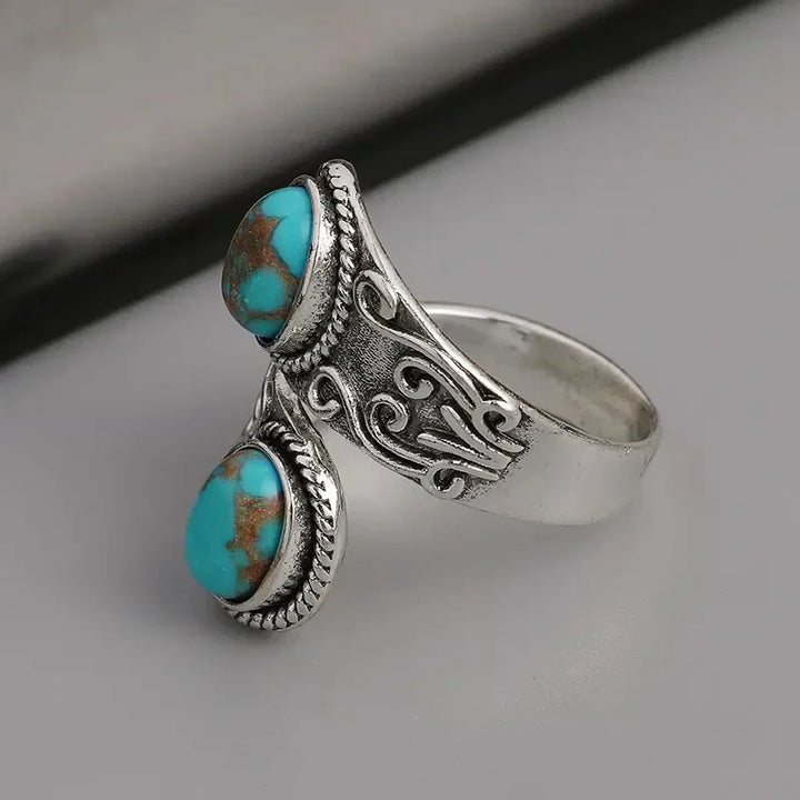 Anillo Cruzado Vintage Elegante en Turquesa
