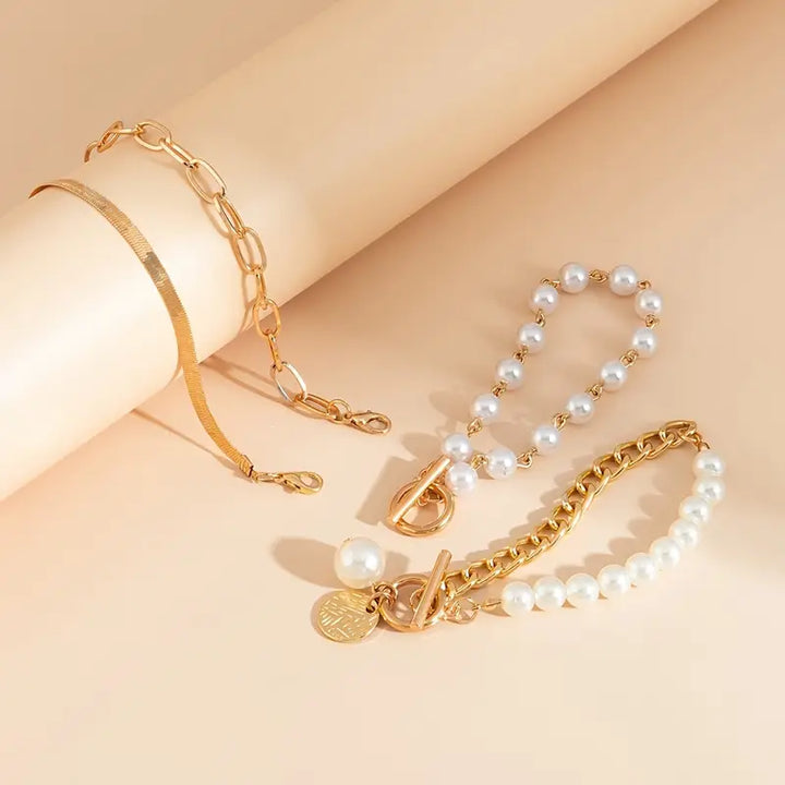 Conjunto de pulseras elegantes en oro (4 piezas) – serpiente, perlas y eslabones