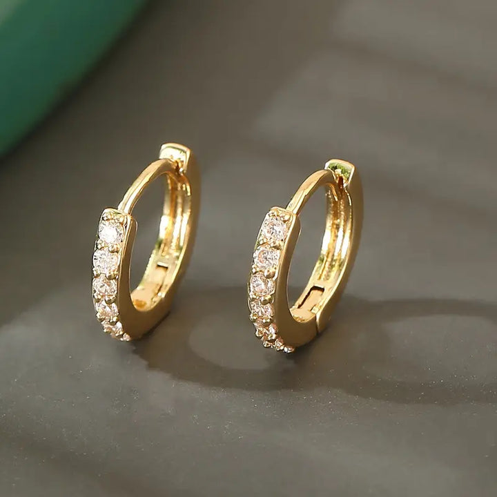 Pendientes colgantes de oro inspirados en la costa